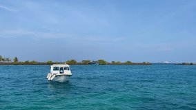 This video shows a small boat swaying lightly in the turquoise blue waters of the Indian Ocean.
This video is suitable for use in a large number of your projects.
From videos dealing with travel topic