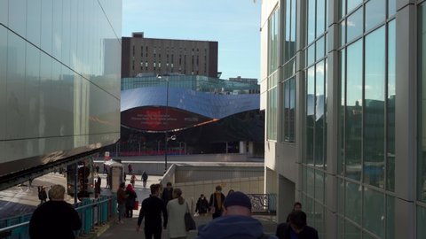BIRMINGHAM, UK - 2022: Birmingham street scene with walking people and Grand Central Station