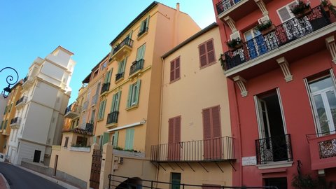 Monaco, October 6, 2021: DOLLY SHOT - The Rue des Remparts street in old district Monaco-Ville with historic buildings near the Prince's Palace of Monaco.