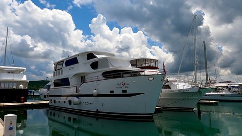 Phuket, Thailand, 02, March, 2022:
Large houseboat in a yacht club, a boat for permanent residence in a yacht marina, house-boat