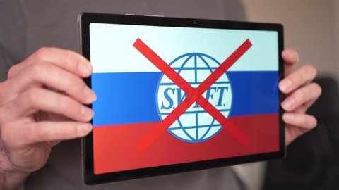 On a tablet screen showing the financial sanction against Russia that is banned from the swift banking system. MONTREAL CANADA MARCH 2022