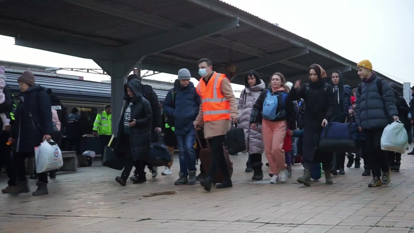 Bucharest, Romania - March 09, 2022: Ukrainian refugees from Ukraine arrived in North Railway Station with a train of 10-car provided by CFR, attempting to escape Vladimir Putin's war against Ukraine.