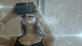 Animation of network of connections over caucasian woman wearing vr headset. connections, technology and data processing concept digitally generated video.