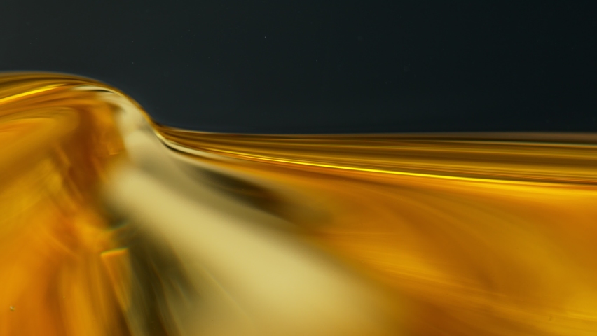 Super Slow Motion Shot of Moving Oil Waves Isolated on Black Background at 1000fps. - Powered by Shutterstock - Get 15% off with code: PIKWIZARD15