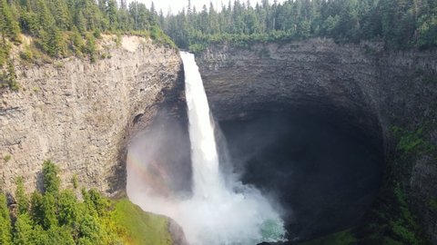 Breathtaking Helmcken Falls plunging into the Murtle River in the idyllic Wells Gray Provincial Park in British Columbia, Canada. Wide angle aerial
