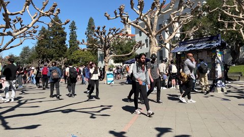 Berkeley, CA - March 8, 2022: 4K HD video of students rushing to and from classes at UC Berkeley Sproul Plaza. 4x normal speed