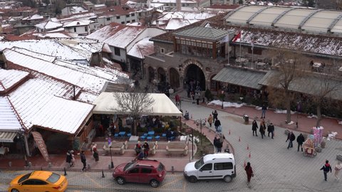 Ankara, Turkey - March 07 2022: Touristic bazaars and facade of Koc musem around Ankara Castle. Cankaya district in background.