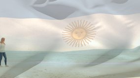 Animation of flag of argentina over caucasian family at beach. patriotism and celebration concept digitally generated video.