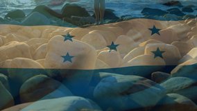 Animation of flag of honduras over caucasian woman at beach. patriotism and celebration concept digitally generated video.