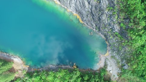 Aerial view lake or pond Amazing view of beautiful fresh and virgin nature in sunny good weather day High quality video from Drone camera Top down beautiful water surface