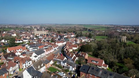 Clare market town in Suffolk England panning Aerial drone footage