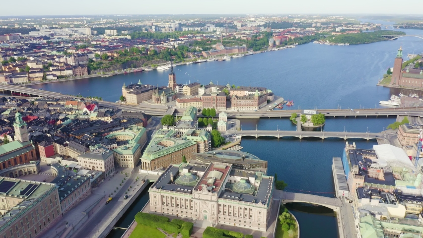 Inscription on video. Stockholm, Sweden. Old Town - Gamla Stan. Riddarholmen. Helgeandsholmen. Aerial view. Heat burns text, Aerial View