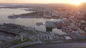 Inscription on video. Oslo, Norway. City view during sunset. Back light. The central part of the city. Aerial view. On the mechanical display, Aerial View, Point of interest