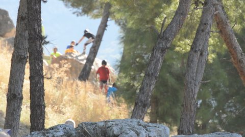 Alhaurin de la Torre, Malaga Spain - 11 16 2017: Motorist trial jumping over a rock in a competition moto trial