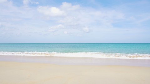 Long beach waves gently lapping shoreline summer Paradise . Beach space area white clouds background. Landscape Sea nature white clean sandy with blue sky.