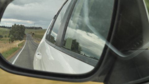 Dunedin, South Island, New Zealand. 01.28.22:
Hand Held Bouncing Mirror Shot In Car
