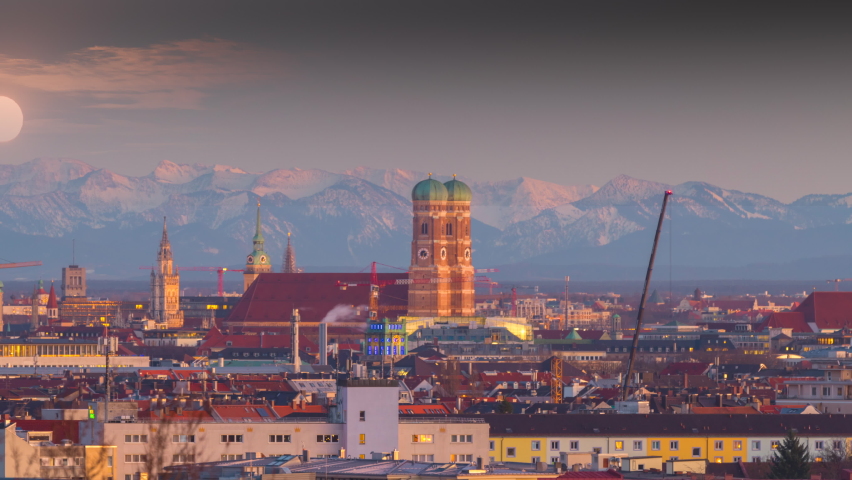 Munich skyline aerial view time lapse, munich at night pre alps mountains winter snow germany time lapse church frauenkirche church marienplatz square. Royalty-Free Stock Footage #1088138127