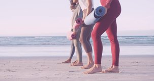 Animation of media icons over diverse women with yoga mats at beach. social media and communication interface concept digitally generated video.
