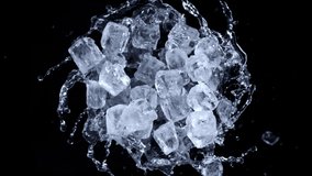 Super slow motion shot of rotating exploded Ice Cubes and splashing water on black at 1000fps. - Powered by Shutterstock - Get 15% off with code: PIKWIZARD15