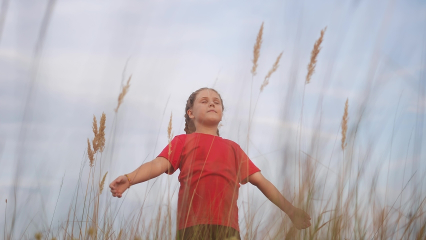 kid pray. pulls hands against a sky. child girl concept faith religion and happy family. kid girl pray hands to the side against sky jew kid praying lifestyle to god. worship and gratitude religion Royalty-Free Stock Footage #1088143905
