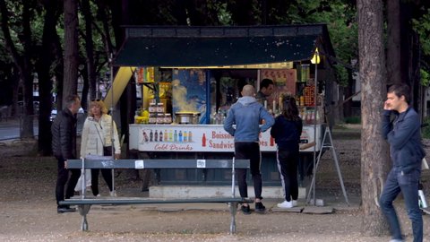 Paris, France - May 2019 : Tourists buying crepes at a crepes hut on the Champs Elysees in Paris France 
