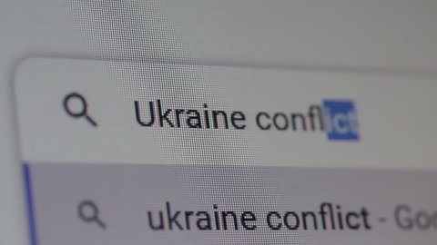 New York, United States - March 2022: Searching for "Ukraine Conflict" on the Internet. Close Up. 