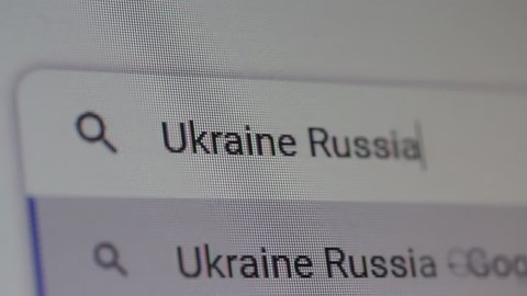 New York, United States - March 2022: Searching for "Ukraine Russia" on the Internet. Close Up. 