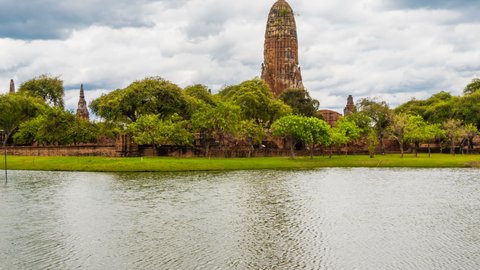 Time Lapse Wat Phra Ram at Ayutthaya Historical Park is an old ancient site, Thailand with reflections of water and many clouds