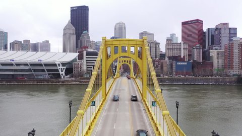Pittsburgh , Pennsylvania , United States - 03 01 2022: Drone flight along Roberto Clemente Bridge towards downtown Pittsburgh, Pennsylvania.