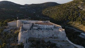 Hvar, Croatia. Aerial view of Spanish fortress and old town in harbor of Adriatic sea on island Hvar. drone 4k video. Summer vacation destination