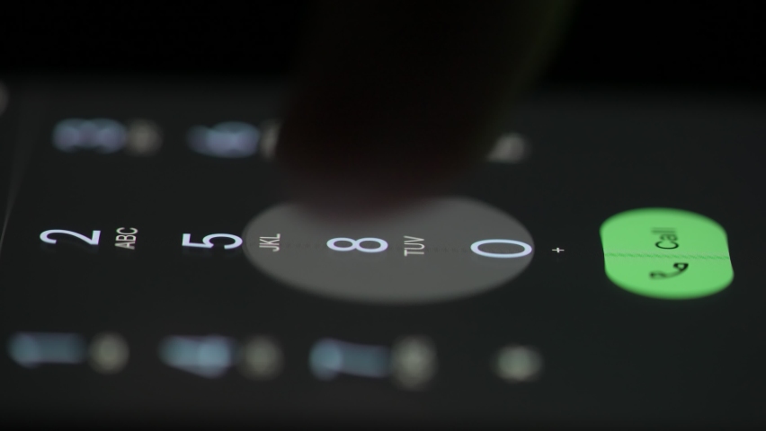 Female finger dials the phone number on the touchscreen of the smartphone. The woman touches the number icons and then presses the call button, an outgoing call. Close up. | Shutterstock HD Video #1088159573