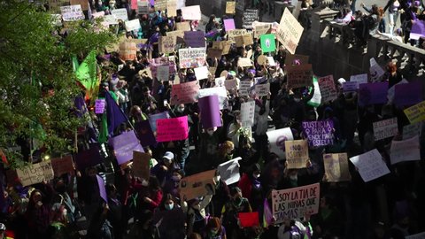 Monterrey, Mexico - March 8th 2022: Top view of women protestors with signs fighting against discrimination and violence, an emotional moment in mexican women history. 8M March for women.