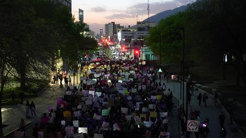 Monterrey, Mexico - March 8th 2022: Thousands of women marching through the city during international women day. 8M march against violence, inequality and women discrimination.
