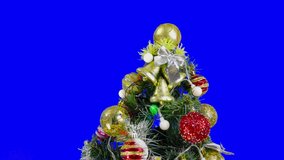 On a blue background chroma key big balls on a christmas tree close-up