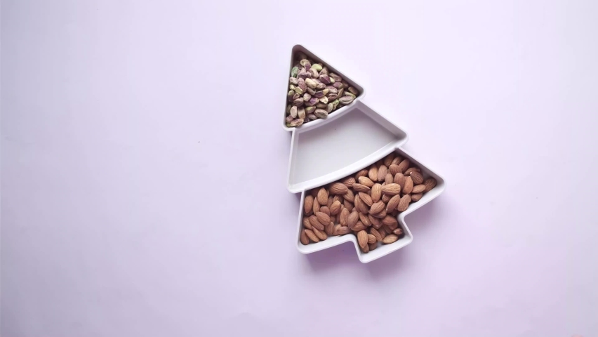 top view of almond, cashew nut and pistachios in a bowl 