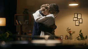 Young couple dancing in living room, listening to vinyl record. Romantic relationships and love. Happy woman and man hugging and enjoying slow dance at home, celebrating anniversary. - Powered by Shutterstock - Get 15% off with code: PIKWIZARD15