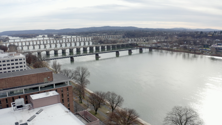 Aerial View of Five Bridges Crossing Over the Susquehanna River Next to Harrisburg, Pennsylvania, Panning Drone Movement