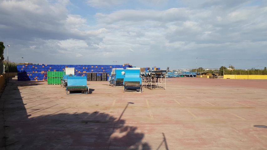 Stacks of fruits and vegetable crates in storehouse