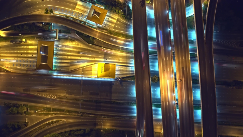 4K UHD : Aerial Top view from drone, Colorfuls of the traffic lights on the highway. night traffic in Bangkok. Transportation and Vehicles concept
