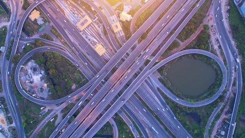 4K UHD : Stunning Aerial time lapse in motion drone shot of freeway and interstate traffic. cars and light streaks. hyperlapse traffic. day to night time lapse.
