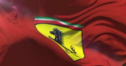 Velez Malaga, Malaga Spain - 09 24 2017: Red flag with logo of Ferrari waving at wind in slow, loop