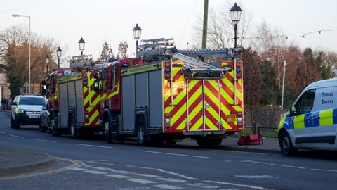 Norwich, Norfolk, United Kingdom. March 9, 2022. Fire engines and police cars parked by roadside at emergency incident Thorpe River Green, Norwich.