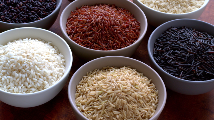 Rice of different colors and varieties. Assortment of rice grains, table spin. | Shutterstock HD Video #1088178793