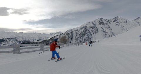 Savoie, France 12.03.2022, A kid enjoying skiing in an Alpine resort. A child enjoys a winter holiday, Stabilized footage