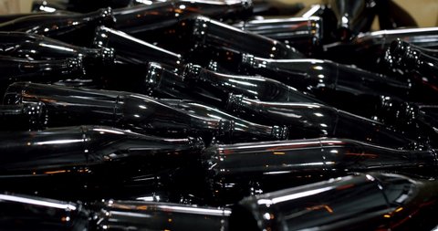 Clean beer and wine bottles. Beer bottles in production and bottling. Technological line. factory concept. Glass recycling process, Recycled beer bottles in factory. conveyor belt at bottle factory