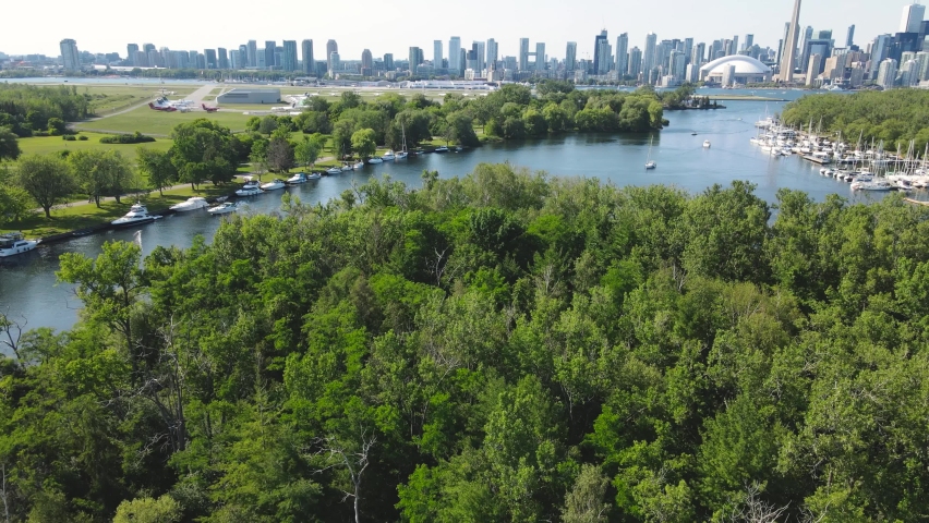 Aerial view of Toronto skyline from the Toronto Islands during a hot day of summer activities.