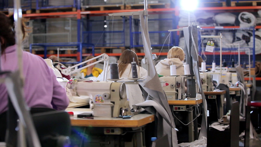 Women work in a sewing workshop. Working process at a textile factory. Modern textile factory Royalty-Free Stock Footage #1088183073