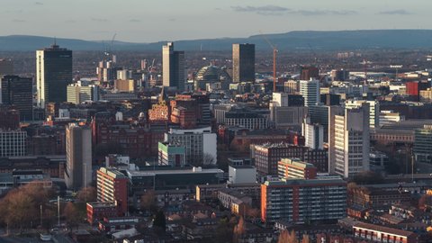 Establishing Aerial View Shot of Manchester UK, England United Kingdom, sunset rays, very city center