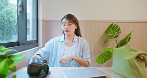 asian woman wearing virtual reality glasses in vr technology with laptop computer by window at home