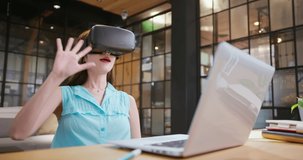 asian businesswoman puts on VR glasses for online meeting metaverse virtual reality technology in office